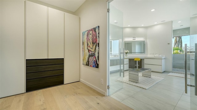 1540 Hillview Dr, Sarasota, FL 34239 - bathroom featuring baseboards, wood finished floors, recessed lighting, and vanity