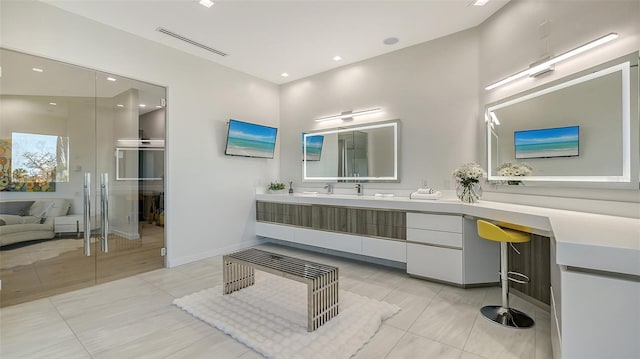 1540 Hillview Dr, Sarasota, FL 34239 - bathroom featuring tile patterned flooring, vanity, recessed lighting, baseboards, and visible vents