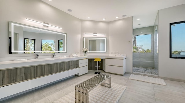 1540 Hillview Dr, Sarasota, FL 34239 - bathroom featuring recessed lighting, tiled shower, tile patterned flooring, and vanity