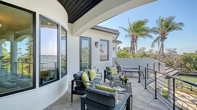 1540 Hillview Dr, Sarasota, FL 34239 - balcony featuring outdoor lounge area and a water view