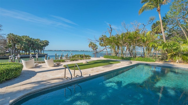 1540 Hillview Dr, Sarasota, FL 34239 - outdoor pool featuring a water view, fence, and a patio area
