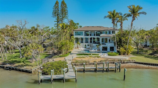 1540 Hillview Dr, Sarasota, FL 34239 - rear view of property with an outdoor pool, fence, a balcony, a water view, and a patio area