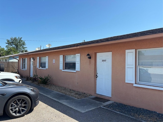 3255 51st Avenue Dr W, Bradenton, FL 34207 - view of front facade featuring stucco siding and fence