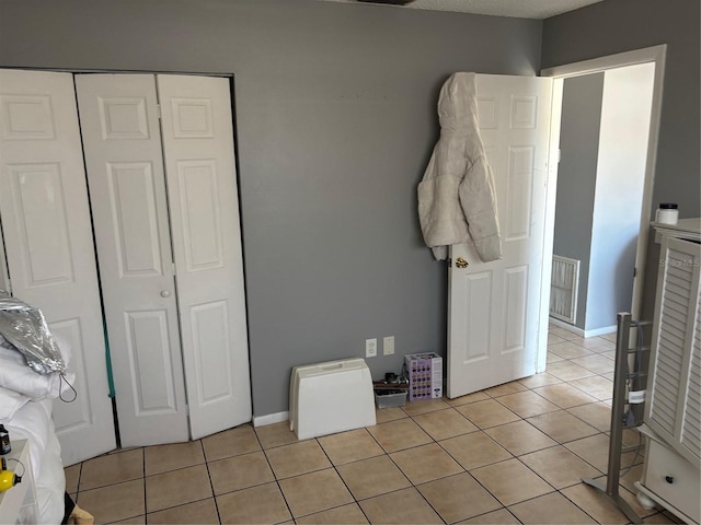 3255 51st Avenue Dr W, Bradenton, FL 34207 - bedroom featuring light tile patterned floors, baseboards, a closet, and visible vents