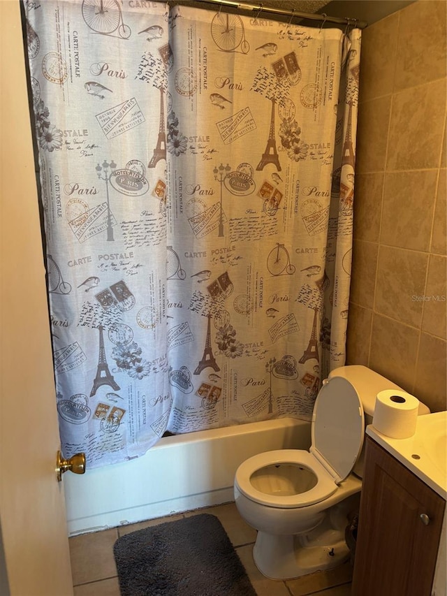 3255 51st Avenue Dr W, Bradenton, FL 34207 - bathroom with tile walls, toilet, tile patterned floors, vanity, and shower / tub combo