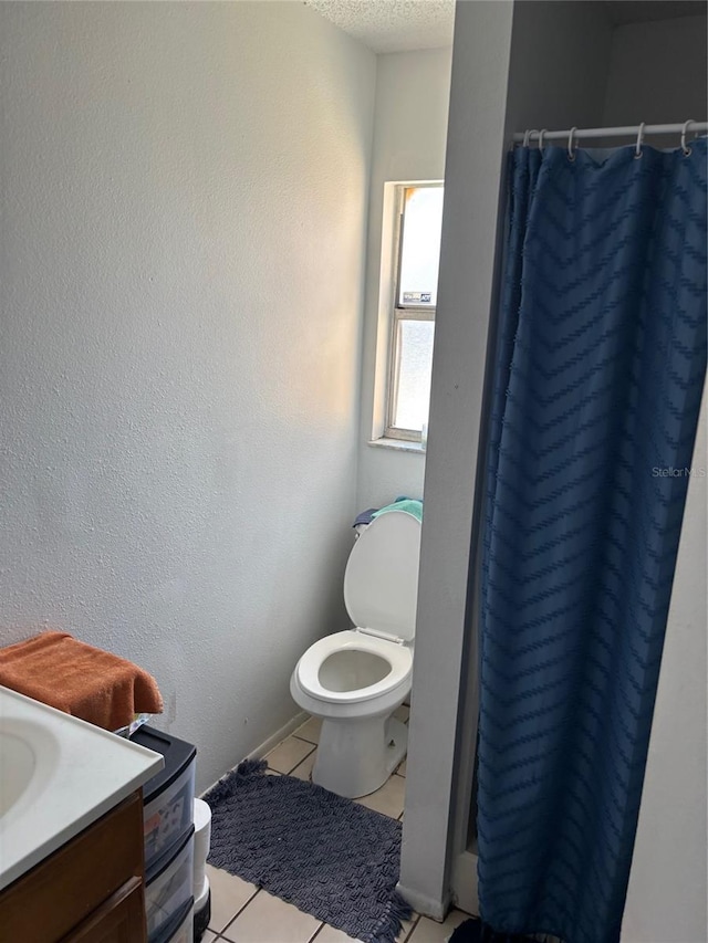 3255 51st Avenue Dr W, Bradenton, FL 34207 - bathroom featuring tile patterned floors, a shower with shower curtain, toilet, vanity, and a textured ceiling