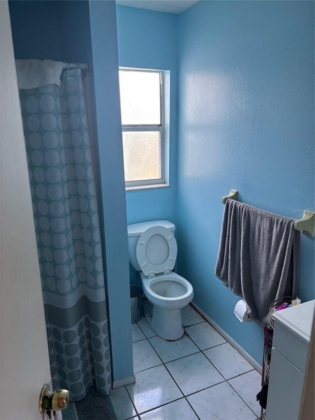3265 51st Avenue Dr W, Bradenton, FL 34207 - full bath featuring a shower with curtain, tile patterned floors, and toilet