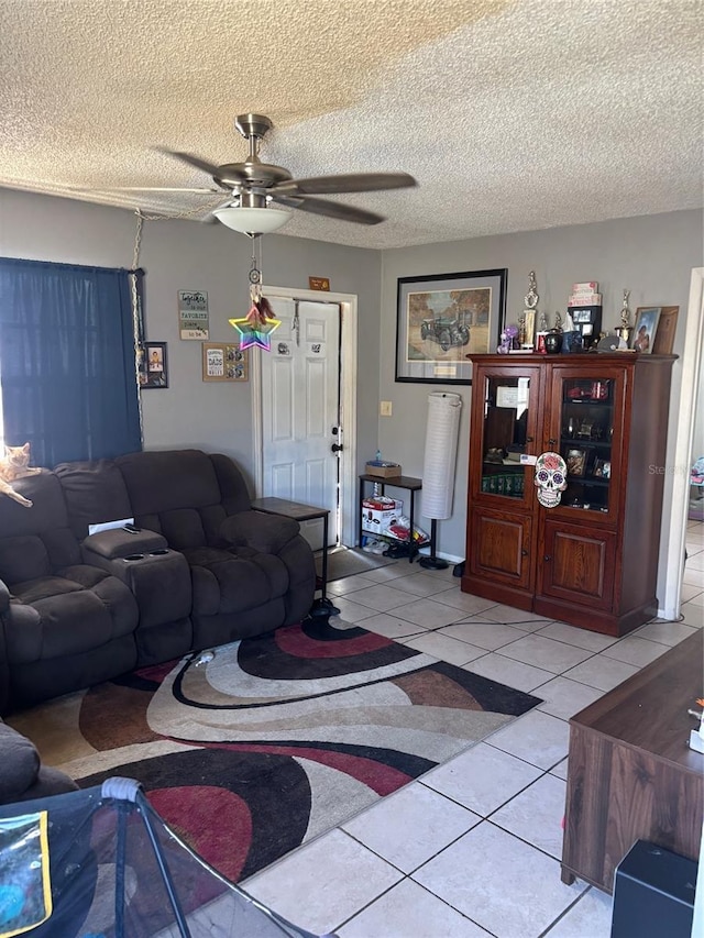 3265 51st Avenue Dr W, Bradenton, FL 34207 - living room featuring a textured ceiling, ceiling fan, and light tile patterned floors