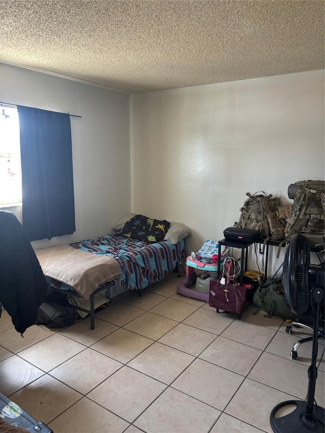 3265 51st Avenue Dr W, Bradenton, FL 34207 - bedroom featuring light tile patterned flooring and a textured ceiling