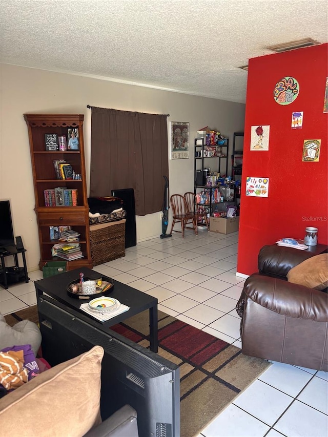 3265 51st Avenue Dr W, Bradenton, FL 34207 - living room featuring light tile patterned flooring and a textured ceiling