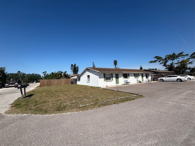 3265 51st Avenue Dr W, Bradenton, FL 34207 - view of front facade featuring fence and a front lawn