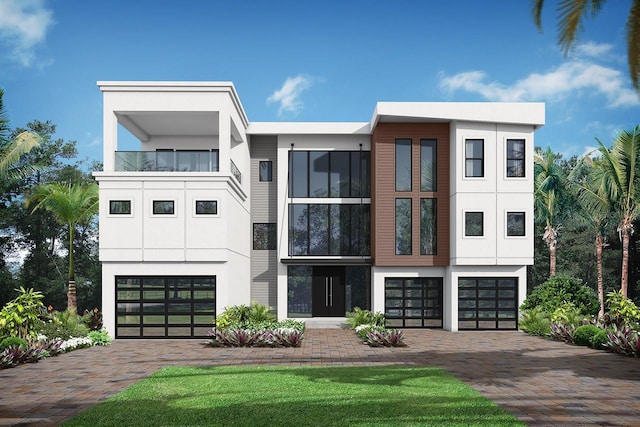 5210 Inspiration Ter, Bradenton, FL 34210 - modern home featuring decorative driveway, stucco siding, and an attached garage