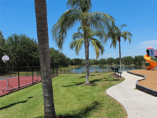 406 Petrel Trl, Bradenton, FL 34212 - surrounding community featuring a water view, playground community, fence, a lawn, and community basketball court