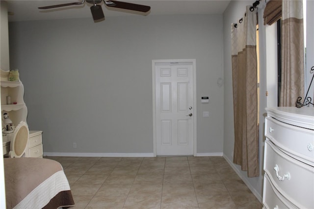 406 Petrel Trl, Bradenton, FL 34212 - bedroom with baseboards, a ceiling fan, and light tile patterned floors
