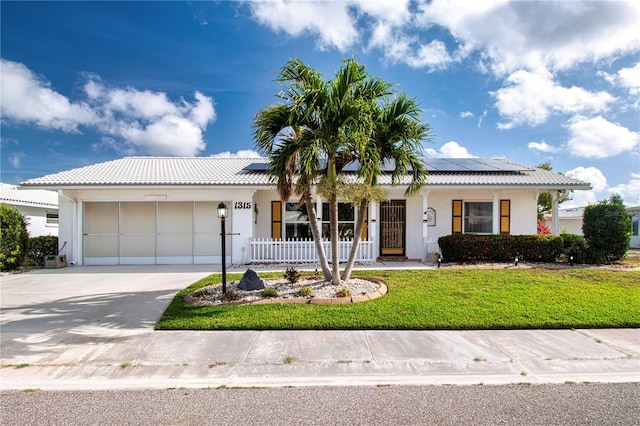 1315 Bottlebrush Dr, Bradenton, FL 34208 - single story home featuring a front yard, driveway, stucco siding, and an attached garage
