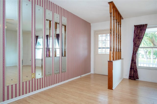 1315 Bottlebrush Dr, Bradenton, FL 34208 - interior space with wallpapered walls, wood finished floors, and a healthy amount of sunlight