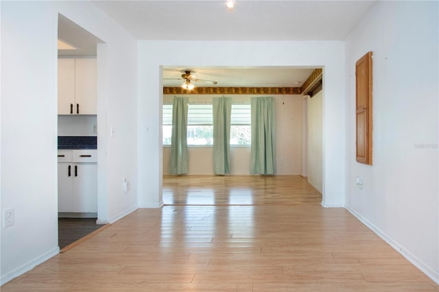 1315 Bottlebrush Dr, Bradenton, FL 34208 - empty room with a ceiling fan, baseboards, and light wood-type flooring