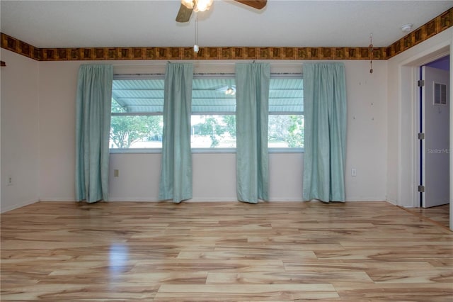 1315 Bottlebrush Dr, Bradenton, FL 34208 - unfurnished room featuring a ceiling fan, plenty of natural light, light wood finished floors, and visible vents