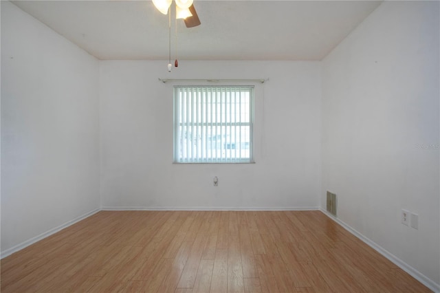 1315 Bottlebrush Dr, Bradenton, FL 34208 - empty room featuring baseboards, visible vents, light wood-style flooring, and ceiling fan