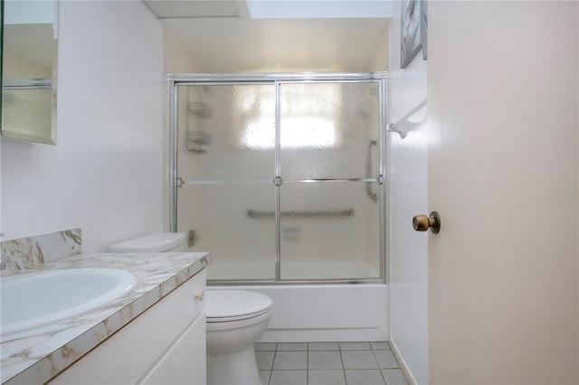 1315 Bottlebrush Dr, Bradenton, FL 34208 - full bathroom with toilet, tile patterned floors, vanity, and enclosed tub / shower combo