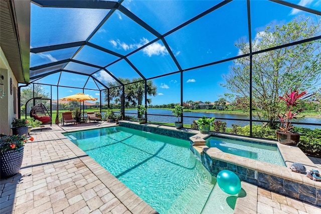 19921 Petrino St, Venice, FL 34293 - view of pool with a patio area, a pool with connected hot tub, a water view, and a lanai