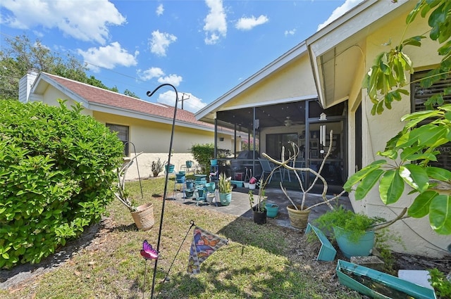 view of yard with a sunroom