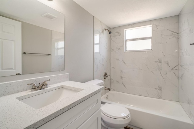 bathroom with toilet, bathing tub / shower combination, and vanity
