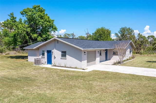 ranch-style house with a garage, a front yard, driveway, central AC, and stucco siding