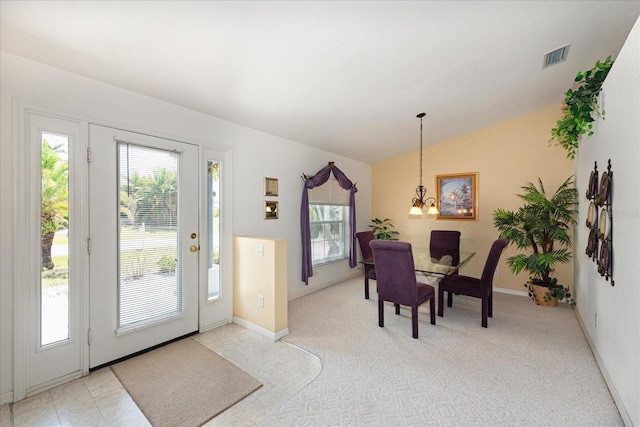 4219 Eastlake Ct, Port Charlotte, FL 33948 - foyer entrance featuring light colored carpet, baseboards, a notable chandelier, and lofted ceiling