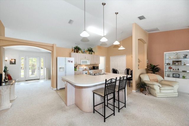 4219 Eastlake Ct, Port Charlotte, FL 33948 - kitchen with light countertops, white appliances, visible vents, and a kitchen breakfast bar