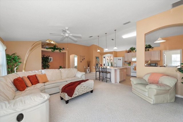 4219 Eastlake Ct, Port Charlotte, FL 33948 - living room with light carpet, ceiling fan, vaulted ceiling, and visible vents