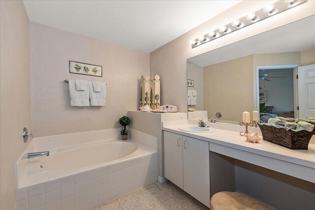 4219 Eastlake Ct, Port Charlotte, FL 33948 - bathroom featuring ensuite bath, vanity, a garden tub, and a ceiling fan
