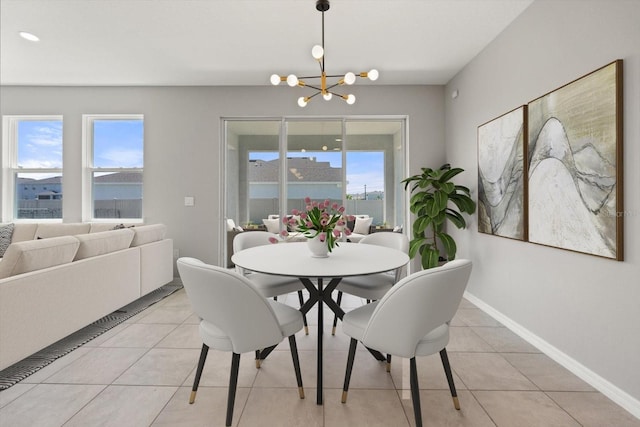 4405 Stargrazer Ct, Palmetto, FL 34221 - dining area with a chandelier, light tile patterned floors, and baseboards