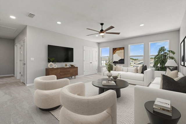 4405 Stargrazer Ct, Palmetto, FL 34221 - living area featuring light carpet, a ceiling fan, recessed lighting, and baseboards
