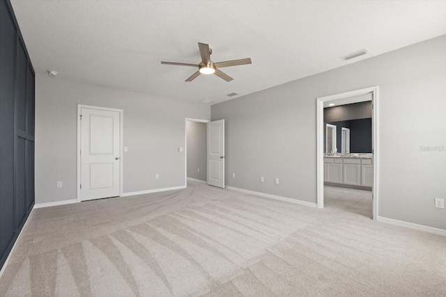 4405 Stargrazer Ct, Palmetto, FL 34221 - unfurnished bedroom with light colored carpet, baseboards, ensuite bathroom, and a ceiling fan