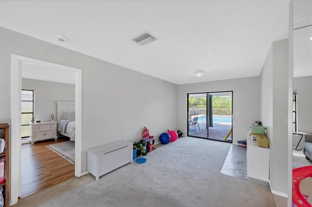 4806 Huntleigh Dr, Sarasota, FL 34233 - recreation room with visible vents and carpet floors