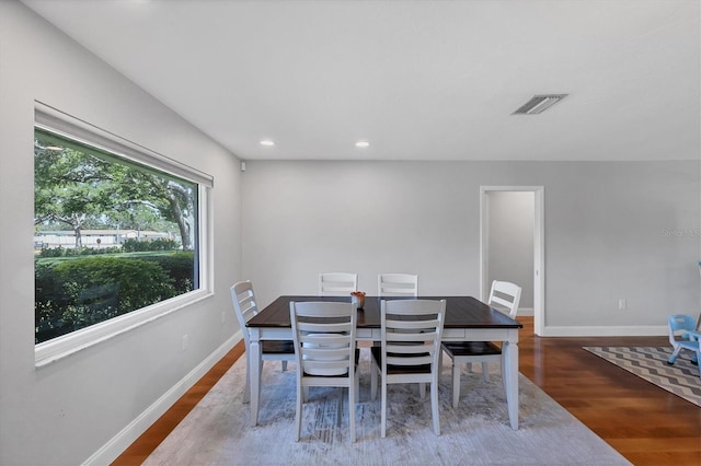 4806 Huntleigh Dr, Sarasota, FL 34233 - dining room with wood finished floors, baseboards, visible vents, and recessed lighting