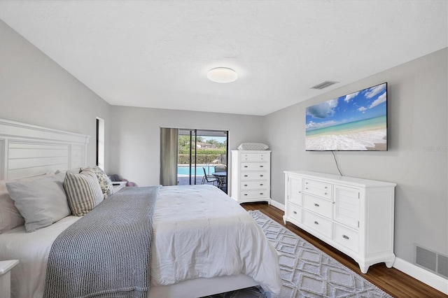 4806 Huntleigh Dr, Sarasota, FL 34233 - bedroom featuring visible vents, access to outside, baseboards, and dark wood finished floors