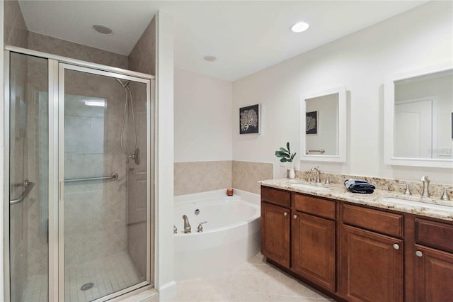 full bathroom featuring a sink, a bath, and a shower stall