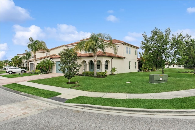 13721 Saw Palm Creek Trl, Lakewood Ranch, FL 34211 - mediterranean / spanish home featuring driveway, a front yard, stucco siding, a tiled roof, and a garage