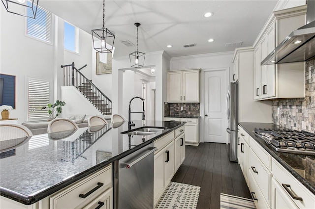 13721 Saw Palm Creek Trl, Lakewood Ranch, FL 34211 - kitchen with a sink, hanging light fixtures, stainless steel appliances, wall chimney range hood, and visible vents