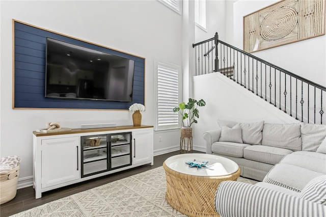 13721 Saw Palm Creek Trl, Lakewood Ranch, FL 34211 - living area with baseboards, a healthy amount of sunlight, stairs, and wood finished floors