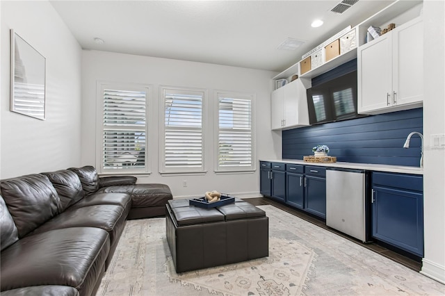 13721 Saw Palm Creek Trl, Lakewood Ranch, FL 34211 - living area with light wood finished floors, baseboards, visible vents, and recessed lighting