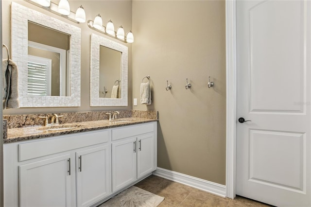 13721 Saw Palm Creek Trl, Lakewood Ranch, FL 34211 - bathroom with double vanity, baseboards, and a sink
