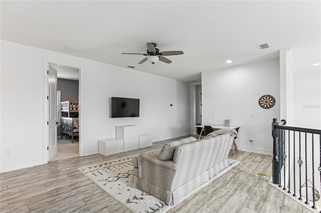 13721 Saw Palm Creek Trl, Lakewood Ranch, FL 34211 - living room with light wood-type flooring, recessed lighting, ceiling fan, and visible vents