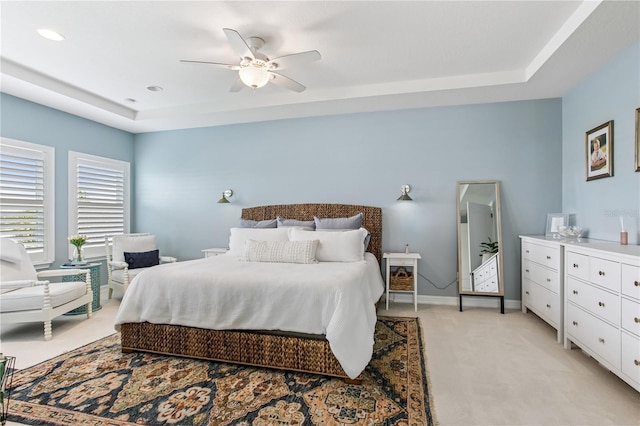 13721 Saw Palm Creek Trl, Lakewood Ranch, FL 34211 - bedroom with a tray ceiling, baseboards, light colored carpet, ceiling fan, and recessed lighting