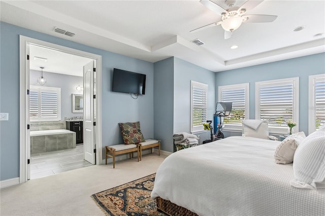 13721 Saw Palm Creek Trl, Lakewood Ranch, FL 34211 - bedroom featuring baseboards, ensuite bath, and visible vents