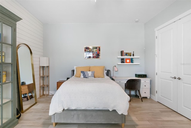bedroom featuring a closet and light wood-style flooring