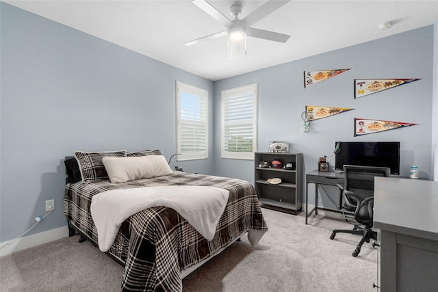 carpeted bedroom with baseboards and ceiling fan