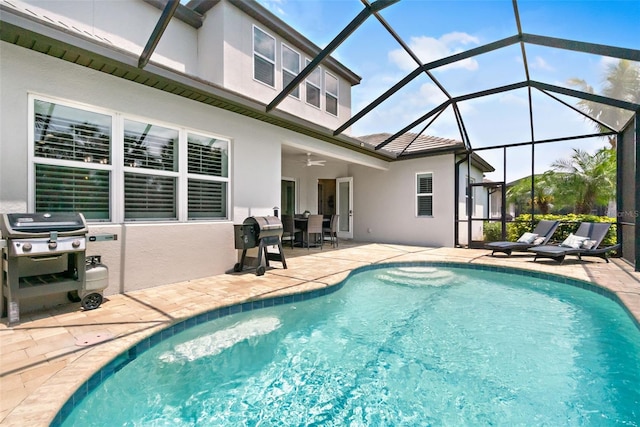 pool with a lanai, area for grilling, ceiling fan, and a patio area